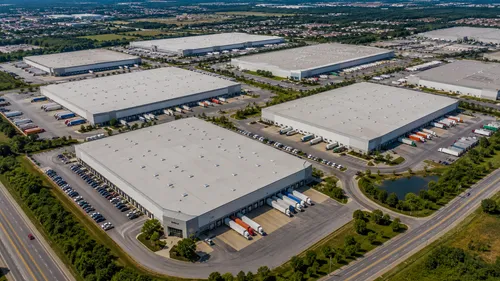Aerial view of multiple large distribution warehouses serving mixed retail brands